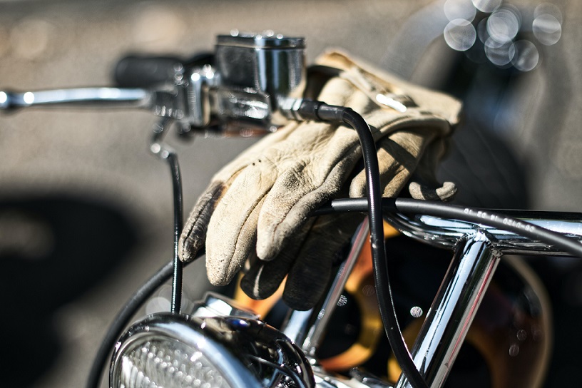Motorcycle Gloves placed on handlebar