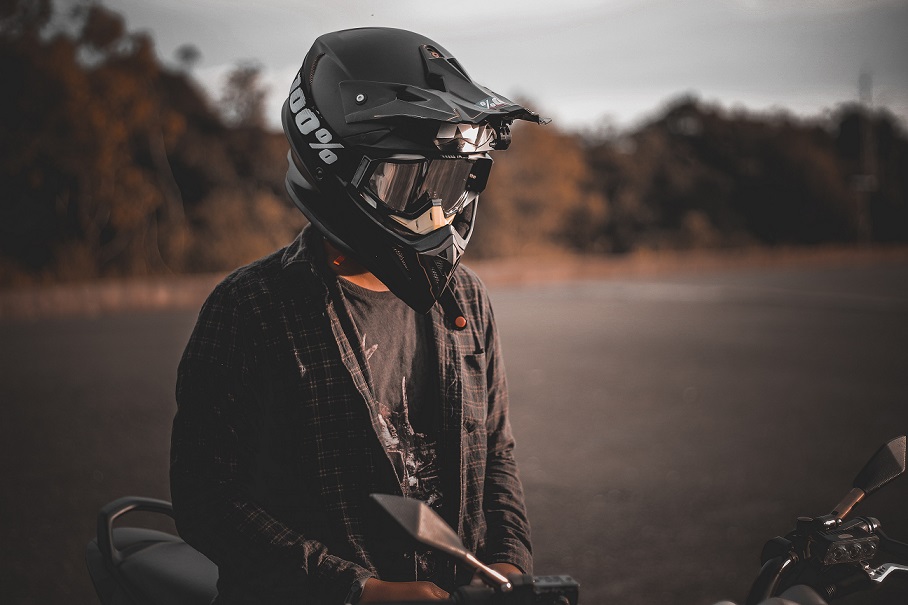 A guy wearing a motorcycle helmet