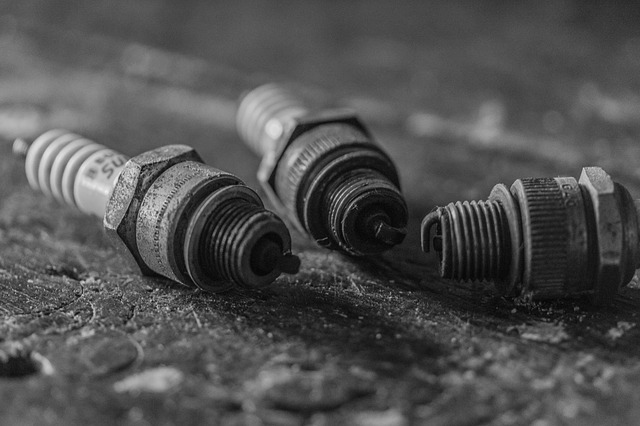 3 spark plugs lying on a table