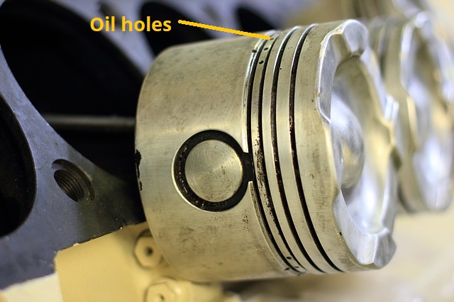 Oil holes on the piston