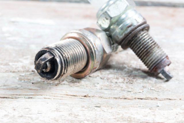 Two spark plugs - normal and used