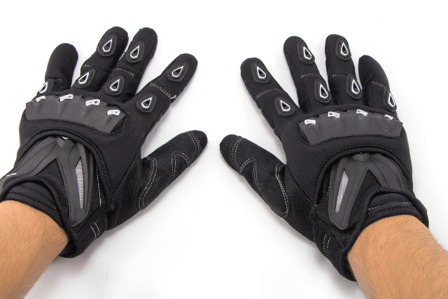 A man wearing Hard knuckle gloves