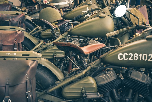 World War 2 motorcycles - green in color stacked together