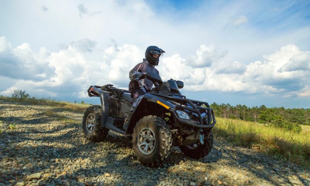 A man riding ATV on a terrain