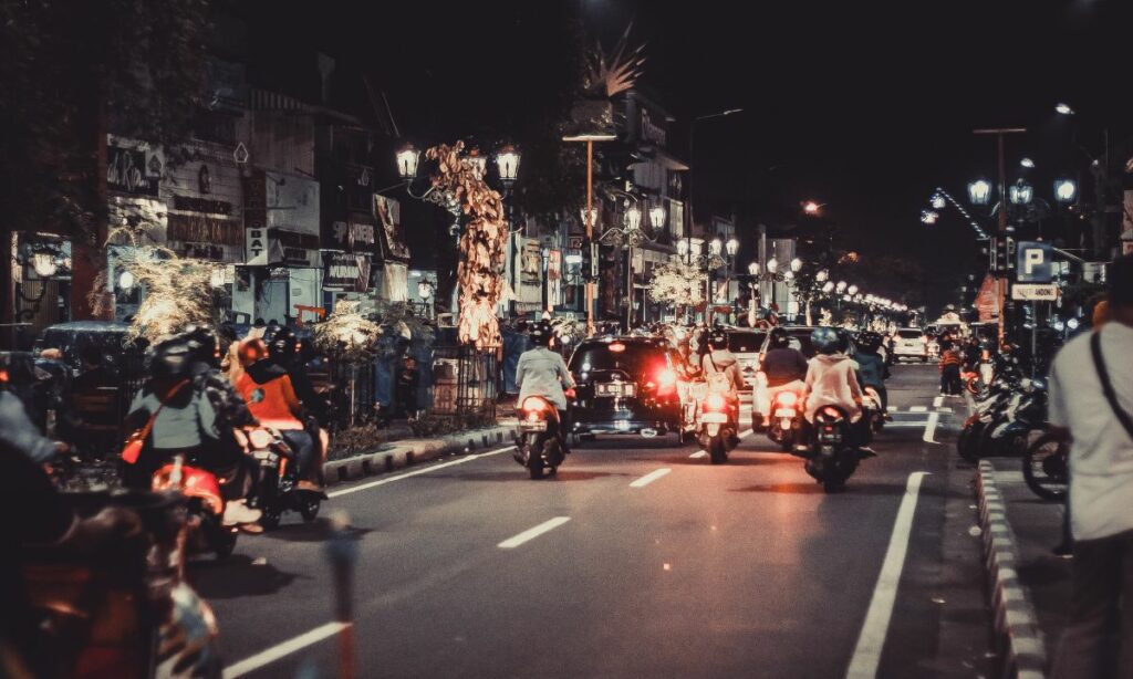Motorcycles on road at night