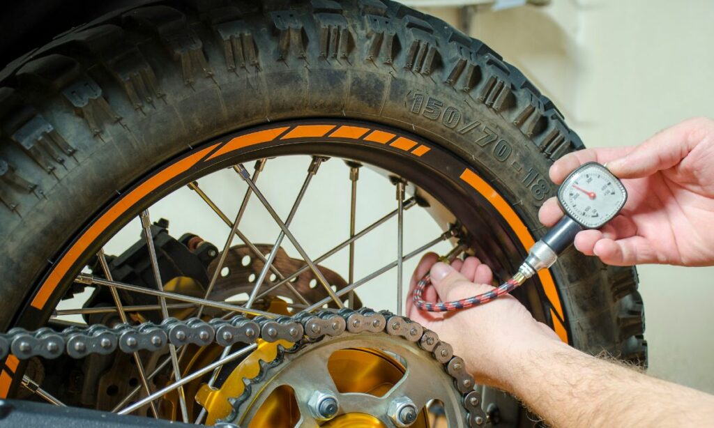Checking psi on motorcycle tire