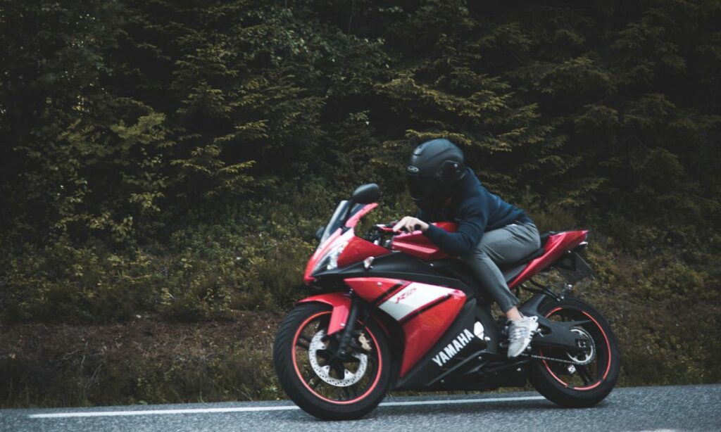 Rider leaning forward on a motorcycle