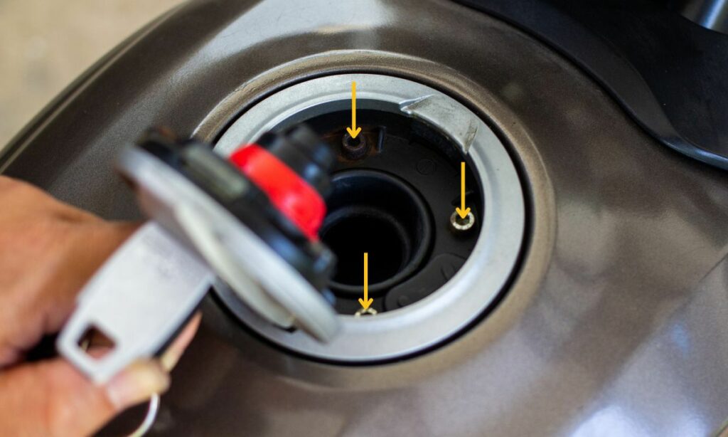 Motorcycle Gas tank holes where water can flow