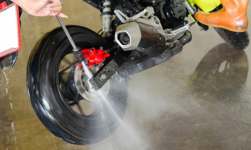 Washing motorcycle with water jet