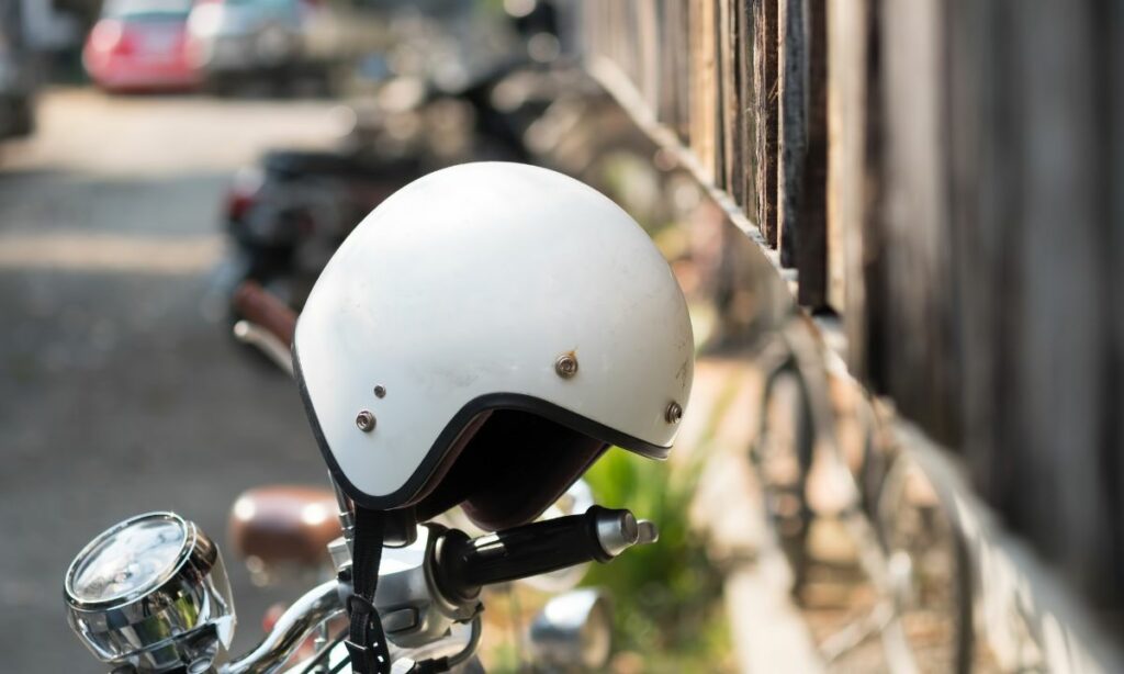 Helmet placed on motorcycle handlebar