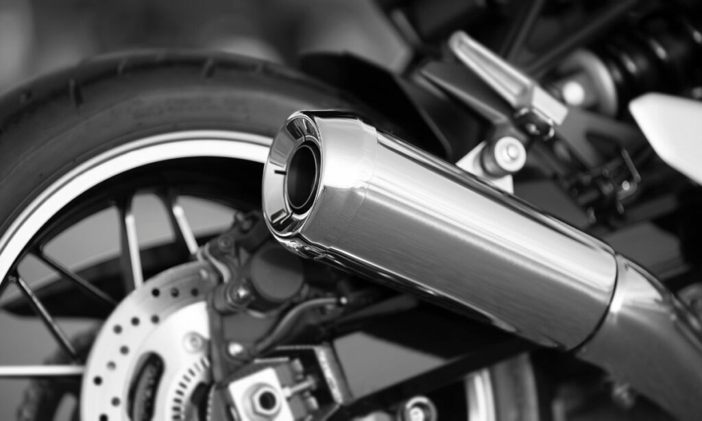 Motorcycle muffler as steel pipe - a black and white image